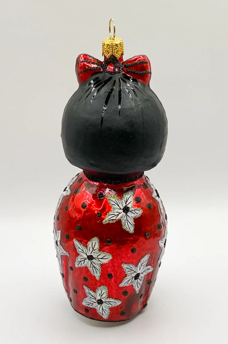 Japanische Kokeshi Puppe Glücksbringer im roten Mantel
