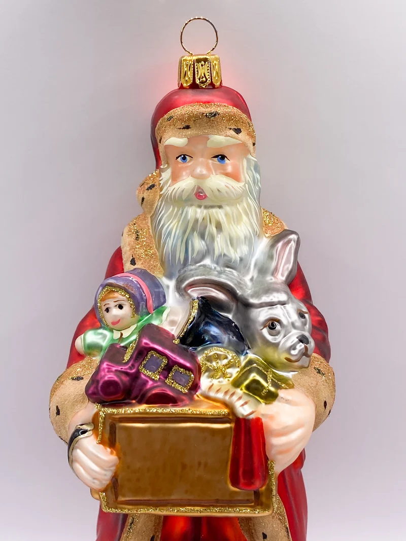 Santa Klaus bringt eine Kiste voll Spielzeug, KOMOZJA MOSTOWSKI