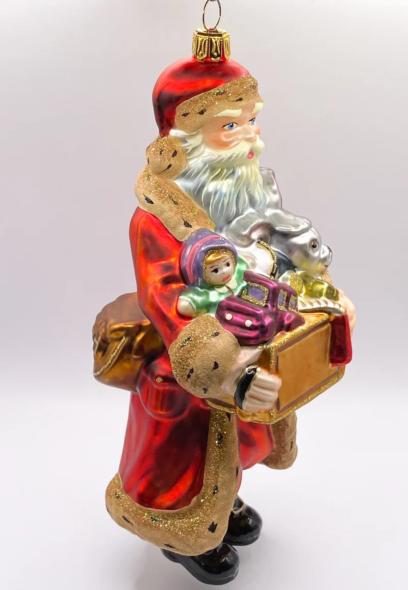 Santa Klaus bringt eine Kiste voll Spielzeug, KOMOZJA MOSTOWSKI