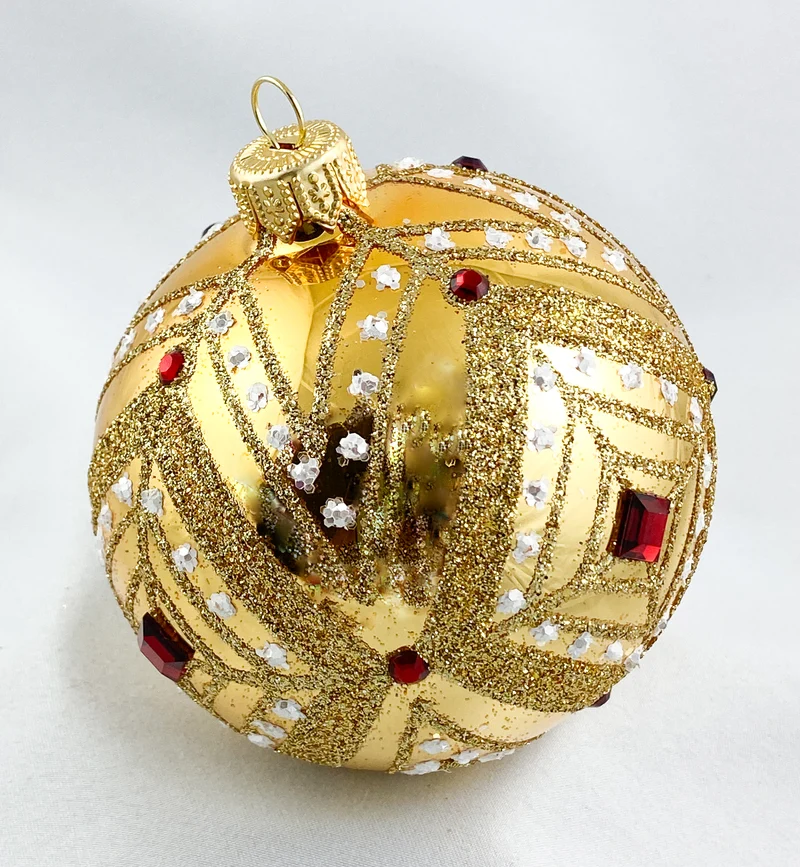 Kugel gold mit Rautendekor und roten Steinen