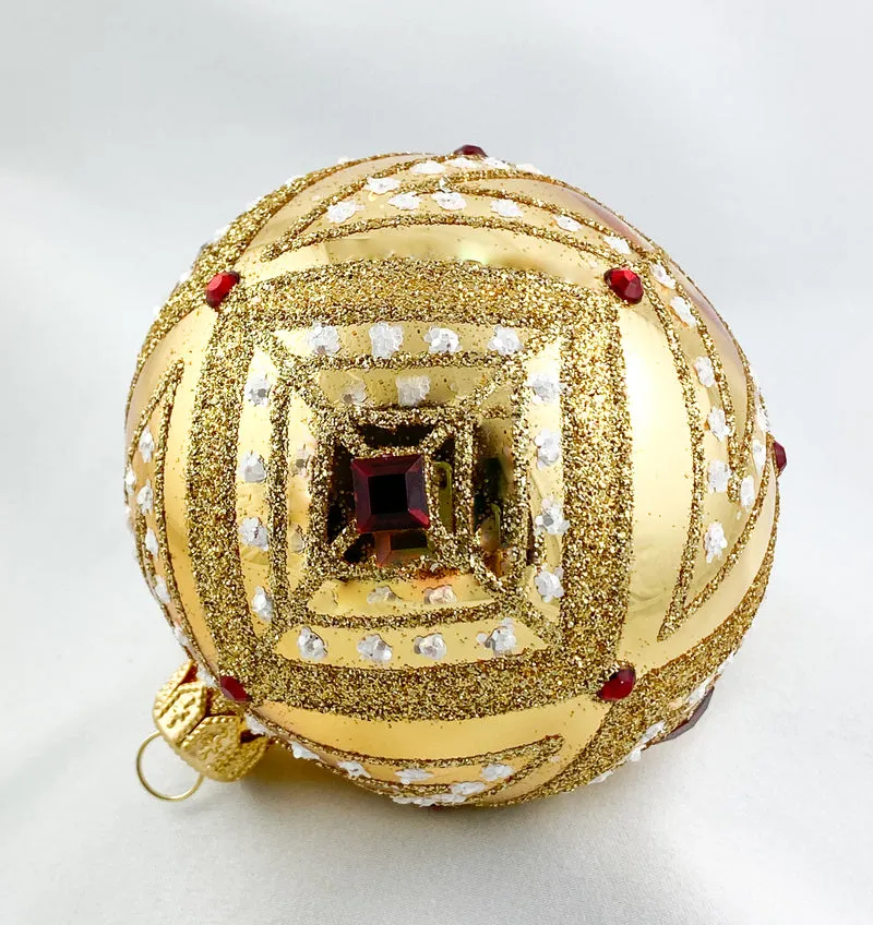 Kugel gold mit Rautendekor und roten Steinen