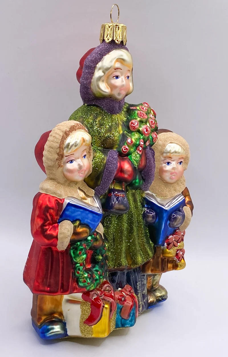 Die Mädchen singen mit der Mama Weihnachtslieder, KOMOZJA MOSTOWSKI