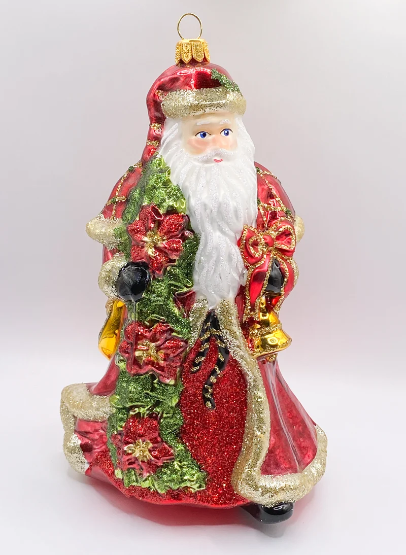 Weihnachtsmann mit Weihnachtsstern und Glocke in rotem Rock
