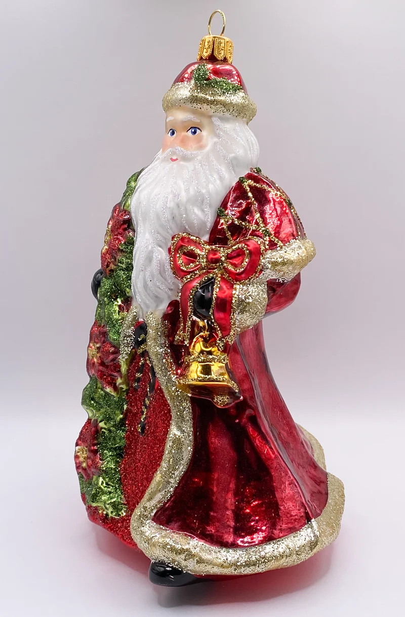 Weihnachtsmann mit Weihnachtsstern und Glocke in rotem Rock