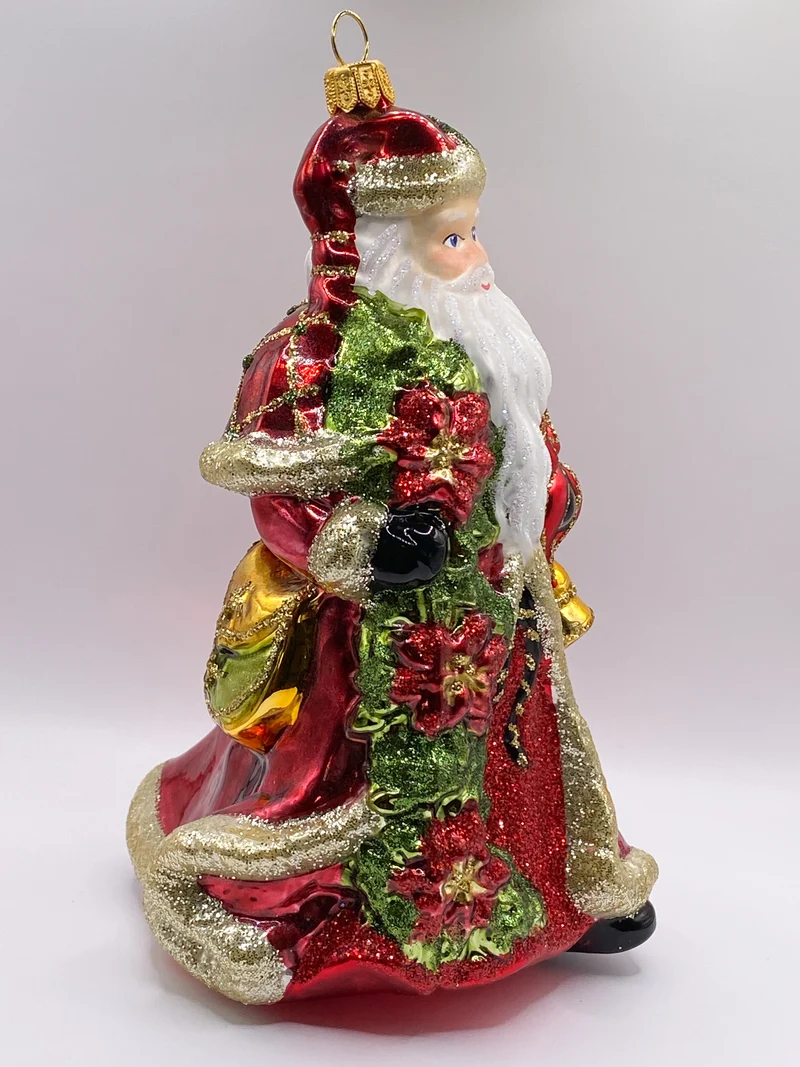 Weihnachtsmann mit Weihnachtsstern und Glocke in rotem Rock